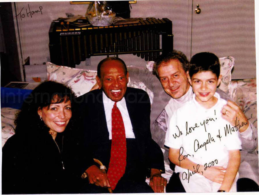8  x 10 inch photograph. Lionel Hampton with Ron Aprea, Angela and Mathew on his 92nd birthday. This photograph is dedicated to Lionel Hampton from Ron, Angela, and Mathew. This is a photocopy of a photograph print
