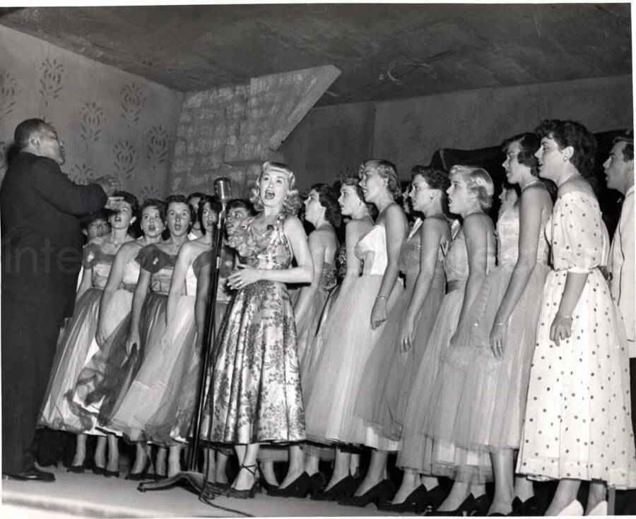 8 x 10 inch photograph. Unidentified choir and conductor performing