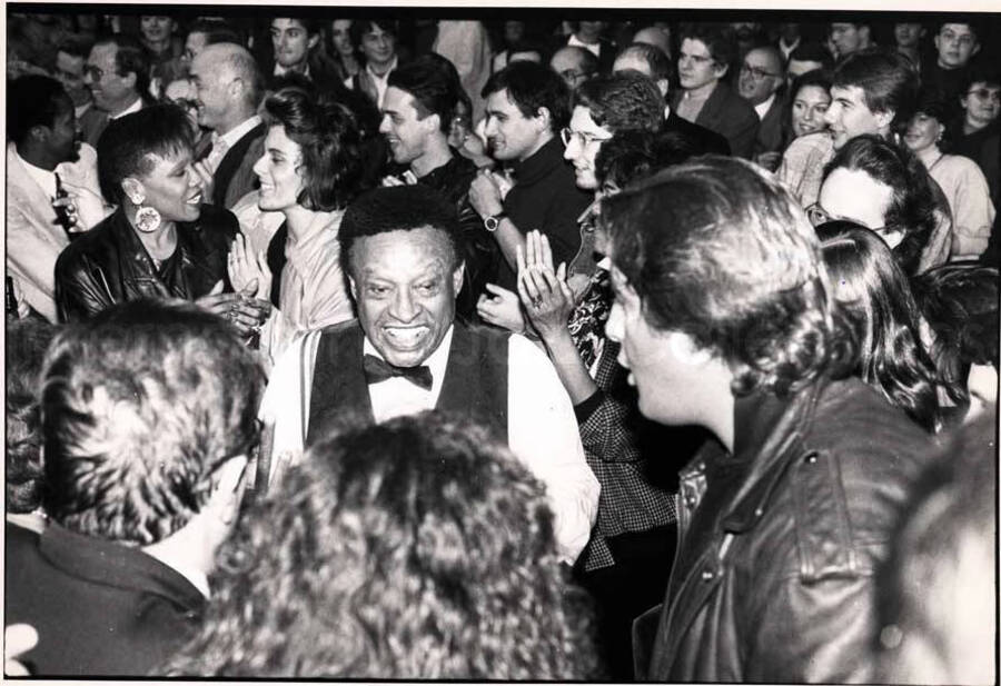 7 x 9 1/2 inch photograph. Lionel Hampton and Dee Dee Bridgewater among audience [in Italy]