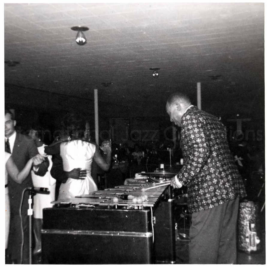 3 1/2 x 3 1/2 inch photograph. Lionel Hampton playing the vibraphone
