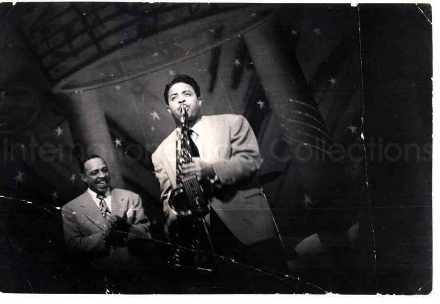 2 3/4 x 4 inch photograph. Lionel Hampton with unidentified saxophonist