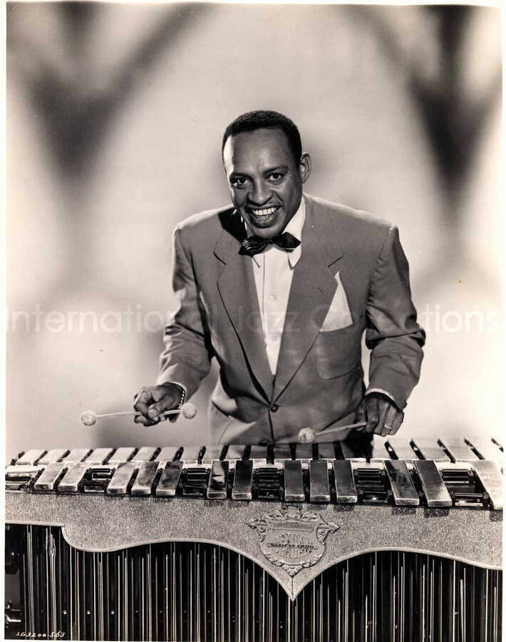 10 x 8 inch photograph. Lionel Hampton playing the Deagan vibraphone