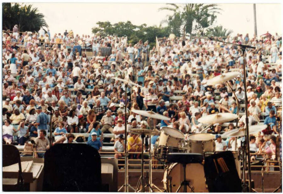 3 1/2 x 5 inch photograph. Audience for an outdoor concert