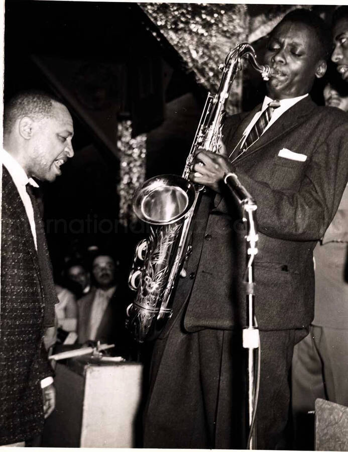 10 x 8 inch photograph. Lionel Hampton with unidentified saxophonist
