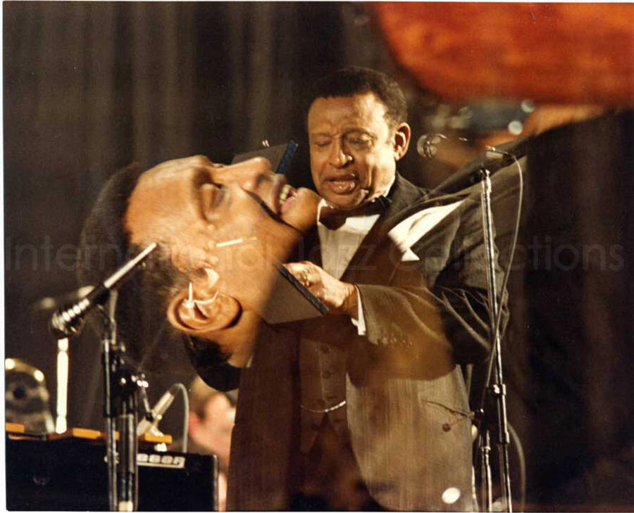 8 x 10 inch photograph. Lionel Hampton holding a box, probably containing a medal [in Italy]