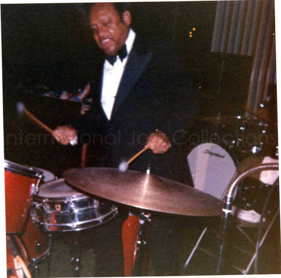 4 x 4 inch photograph. Lionel Hampton playing the drums
