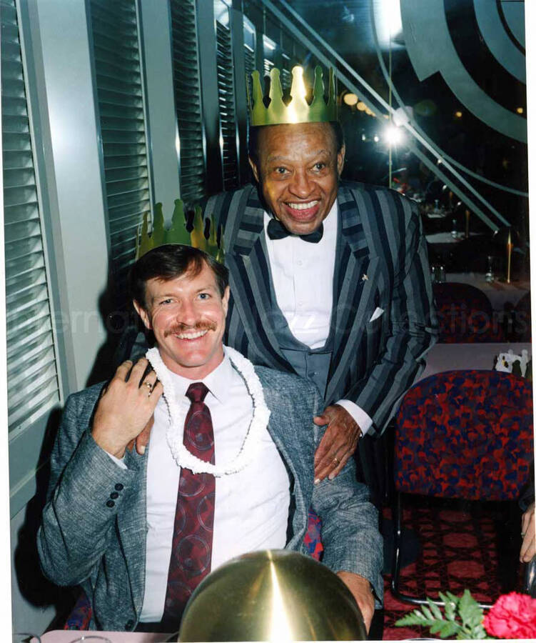 10 x 8 inch photograph. Lionel Hampton with unidentified man. This photograph was in a portfolio with the inscription: Cruiseship Pictures