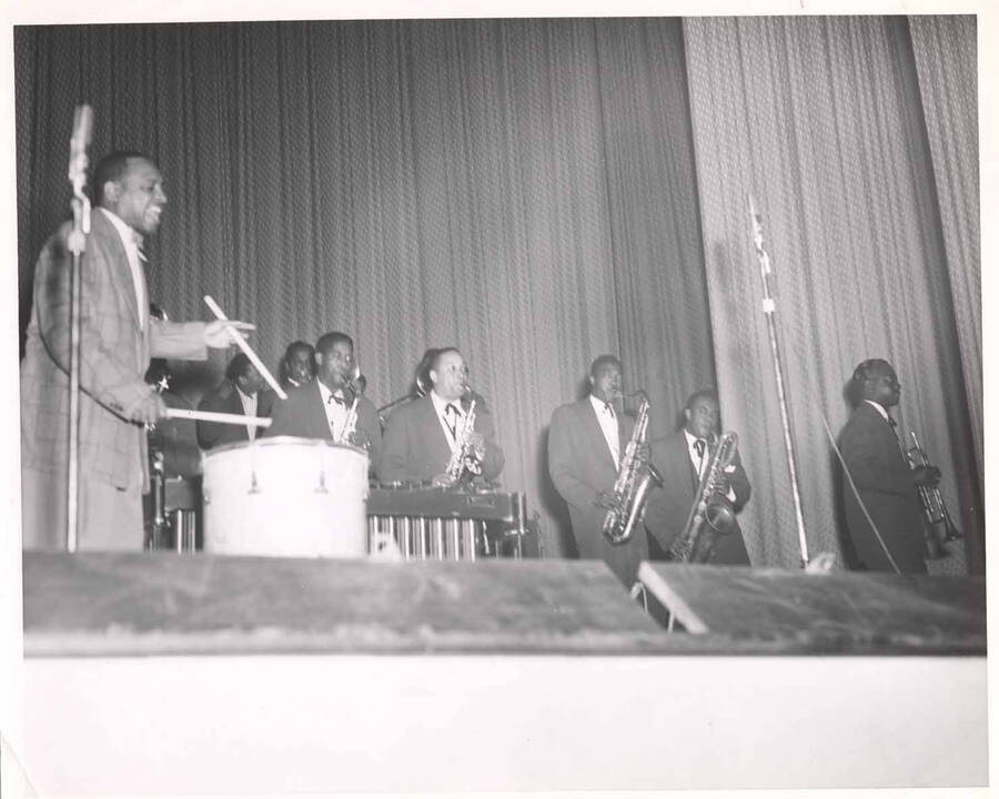 8 x 10 inch photograph. Lionel Hampton on drums with band