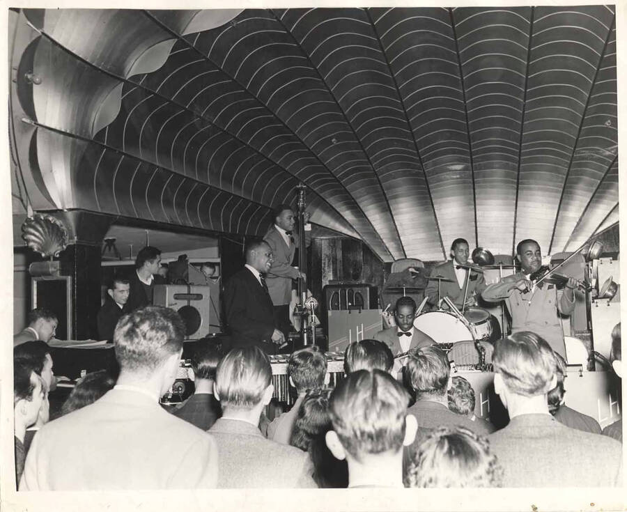8 x 10 inch photograph. Lionel Hampton with band. Handwritten on the back of the photograph: Palomar Ballroom, Seattle, Washington