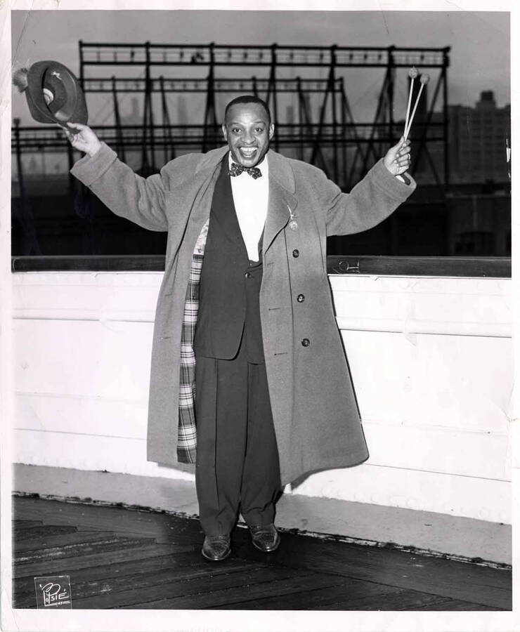 10 x 8 inch photograph. Lionel Hampton poses on board of a ship