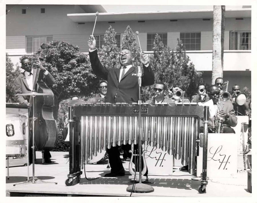 7 x 9 inch photograph. Lionel Hampton playing the vibraphone at an outdoor concert