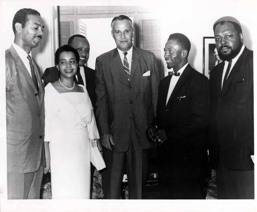 8 x 10 inch photograph. Lionel Hampton with Mattiwilda Dobbs and unidentified men