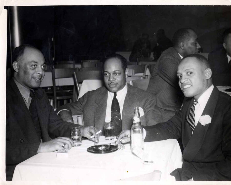 8 x 10 inch photograph. Lionel Hampton with unidentified men
