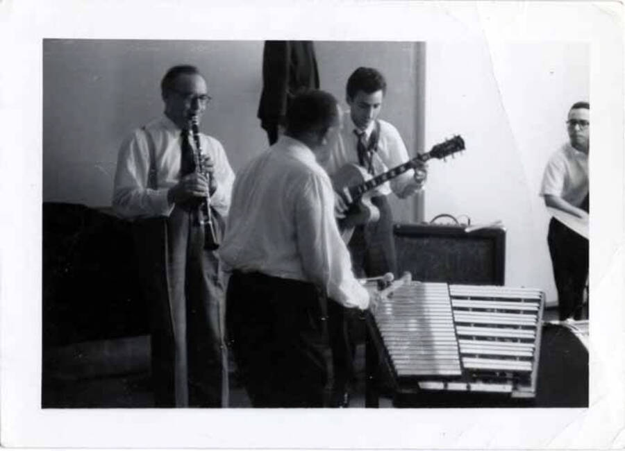 3 1/2 x 4 1/2 inch photograph. Lionel Hampton on vibraphone with [Benny Goodman] on clarinet and unidentified guitarist