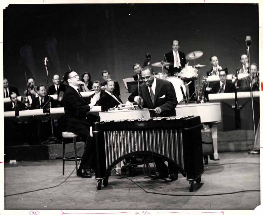 8 x 10 inch photograph. Lionel Hampton playing the vibraphone with Steve Allen on piano and orchestra