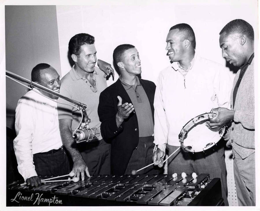8 x 10 inch photograph. Lionel Hampton with Maury Willis and unidentified musicians