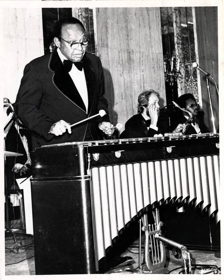 10 x 8 inch photograph. Lionel Hampton performing with band at a formal reception