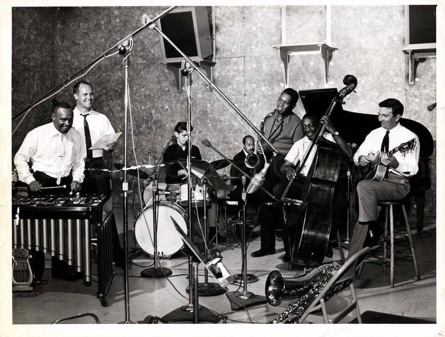 7 x 9 inch photograph. Lionel Hampton on the vibraphone with band which includes double bassist Milt Hinton