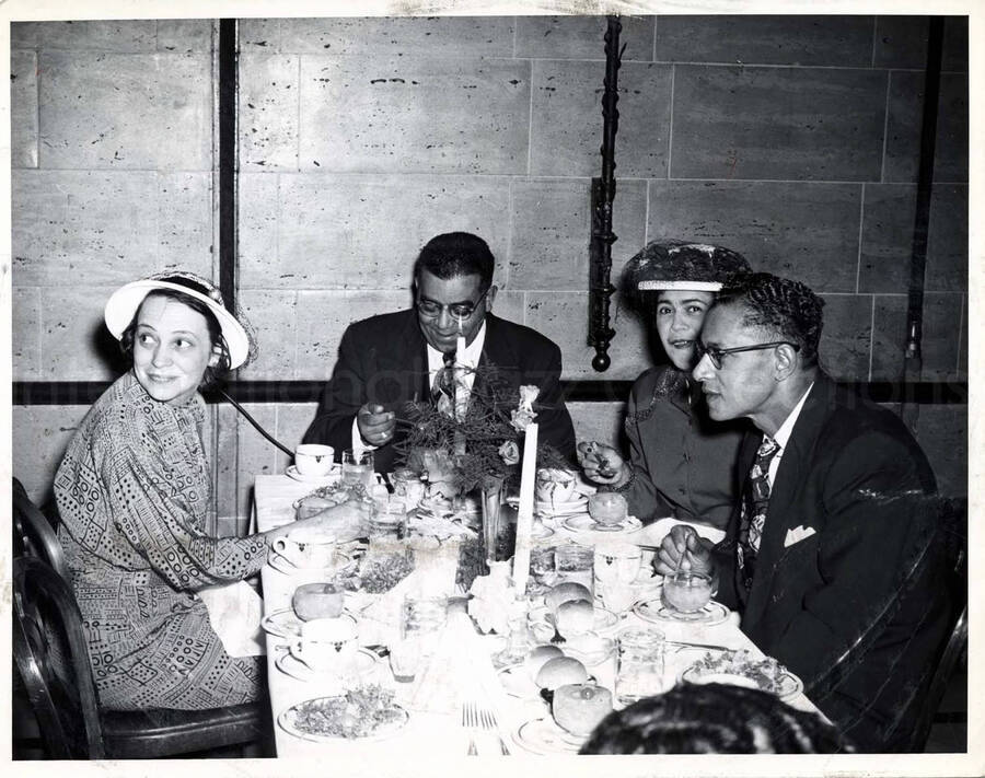 8 x 10 inch photograph. Unidentified persons in a restaurant
