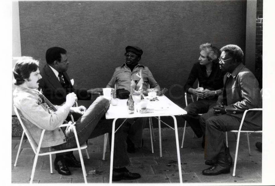 4 x 5 1/2 inch photograph. Lionel Hampton with Bill Titone and unidentified men