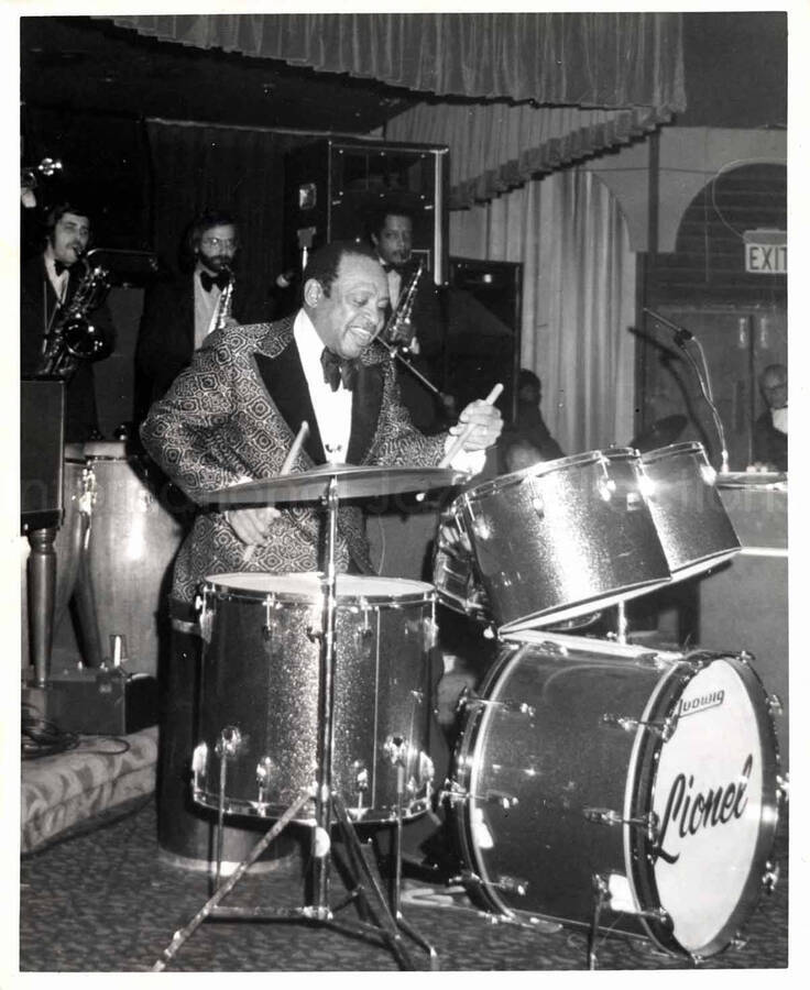 10 x 8 inch photograph. Lionel Hampton playing the drums