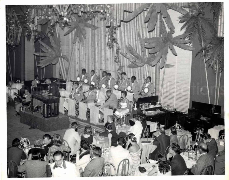 8 x 10 inch photograph. Lionel Hampton playing the vibraphone with band which includes guitarist Billy Mackel