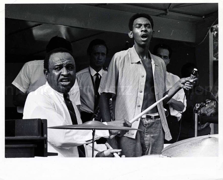 8 x 10 inch photograph. Lionel Hampton playing the drums with unidentified vocalist