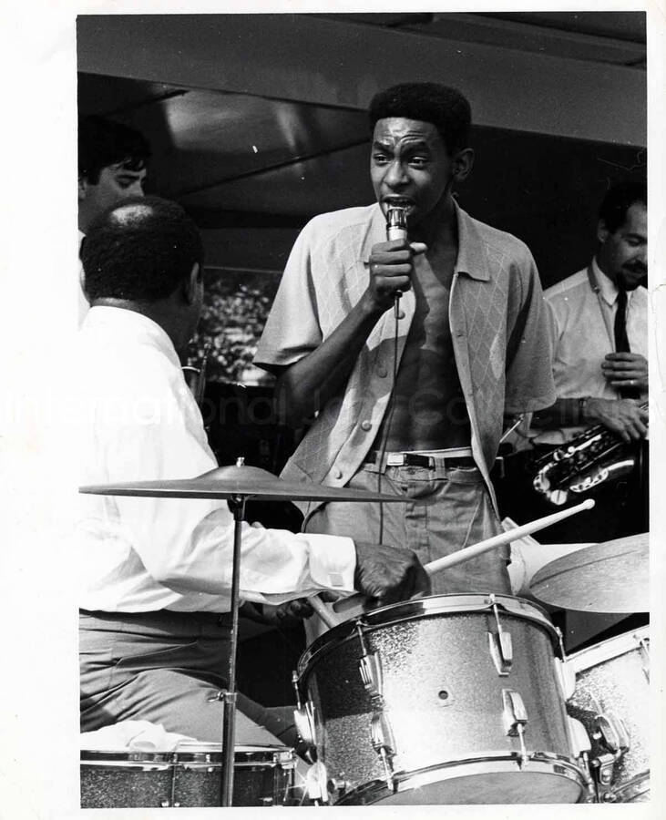 10 x 8 inch photograph. Lionel Hampton playing the drums with unidentified vocalist