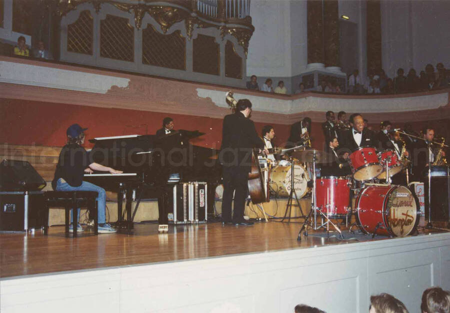 3 1/2 x 5 inch photograph. Lionel Hampton playing the drums with a young member of the Hamp-tones on piano