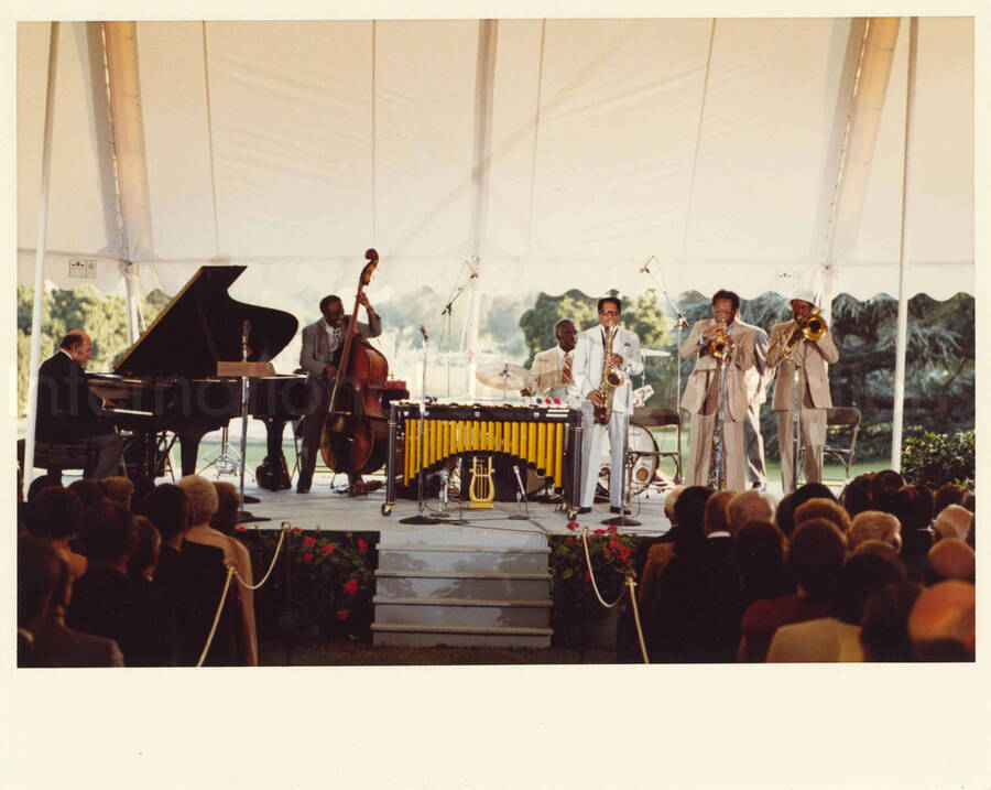 8 x 10 inch photograph. Al Grey and other musicians at an outdoor concert at the White House. This concert was aired January 27, 1982 on the public television special, Great Vibes! Lionel Hampton and Friends, as part of the Kennedy Center Tonight series