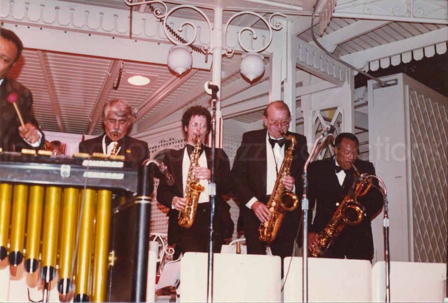3 1/2 x 5 inch photograph. Lionel Hampton playing the vibraphone with band [at Disneyland]