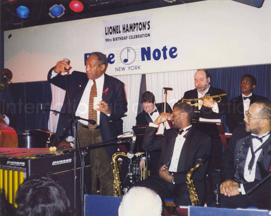 8 x 10 inch photograph. Bill Cosby and band. Lionel Hampton's 90th birthday at the Blue Note in New York