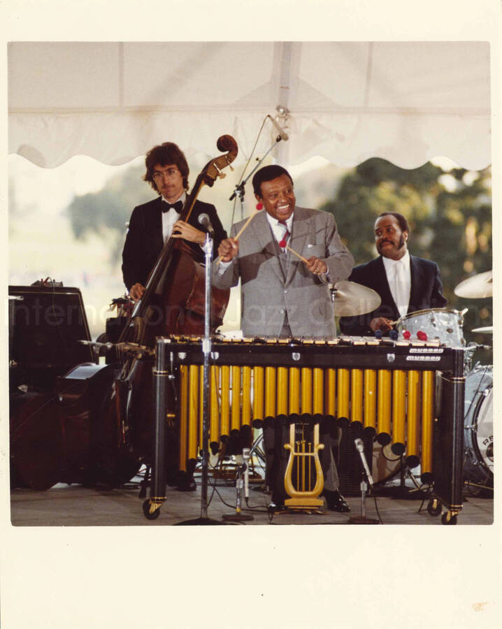 10 x 8 inch photograph. Lionel Hampton on vibraphone with other musicians at an outdoor concert at the White House. This concert was aired January 27, 1982 on the public television special, Great Vibes! Lionel Hampton and Friends, as part of the Kennedy Center Tonight series. See contact sheets for more images of this event