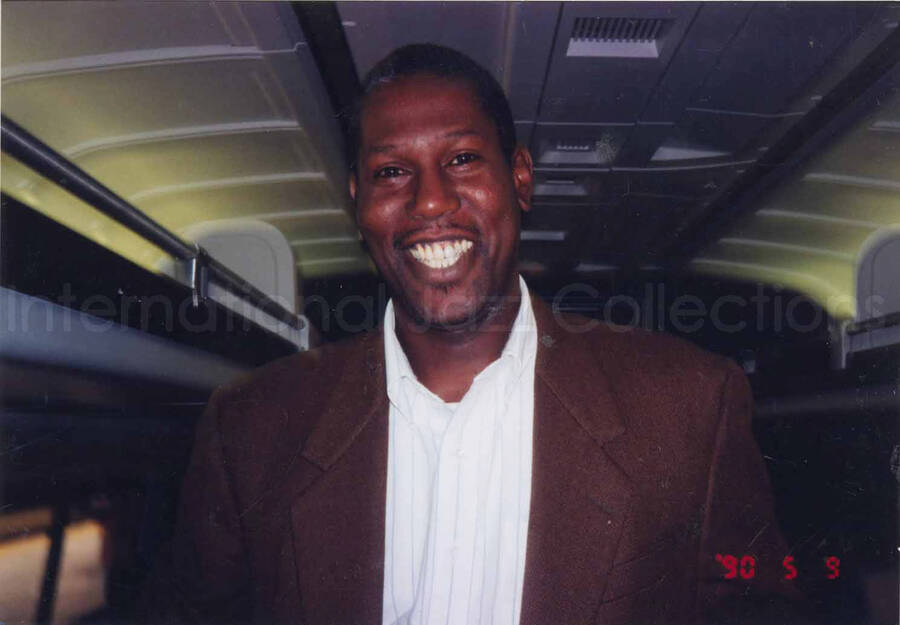 4 x 6 inch photograph. Reuben, Lionel Hampton's valet, on an airplane.