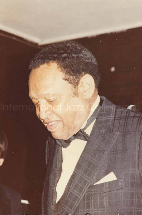 6 x 4 inch photograph. Lionel Hampton on the occasion he receiving a plaque from the Mother African Methodist Episcopal Zion Church. Label on the back of the photograph reads: D. P. A. Syndicate, New York, NY