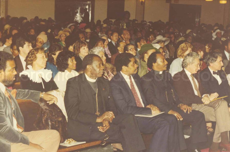 4 x 6 inch photograph. Audience on the occasion Lionel Hampton receiving a plaque from the Mother African Methodist Episcopal Zion Church. Label on the back of the photograph reads: D. P. A. Syndicate, New York, NY