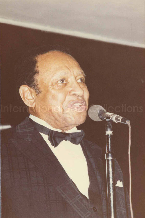 6 x 4 inch photograph. Lionel Hampton on the occasion he receiving a plaque from the Mother African Methodist Episcopal Zion Church. Label on the back of the photograph reads: D. P. A. Syndicate, New York, NY