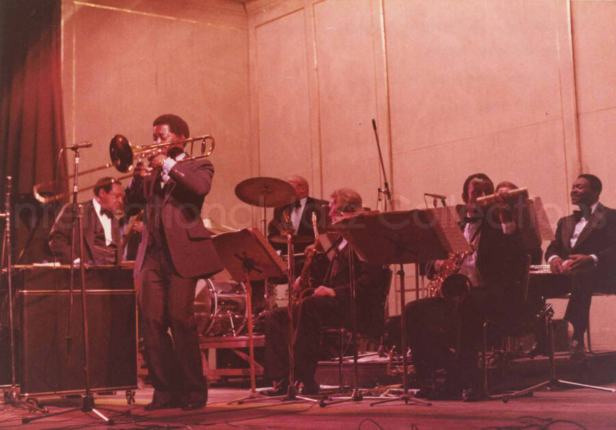 5 x 7 inch photograph. Lionel Hampton with band. Handwritten on the back of the photograph: Teatro El Circulo, Rosario, Argentina; Lionel Hampton All Stars; Curtis Fuller soloing. This photograph has a dedication from Wis Contijoch and Ruben Gonzalez