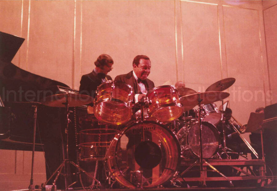5 x 7 inch photograph. Lionel Hampton  on drums with band. Handwritten on the back of the photograph: Teatro El Circulo, Rosario, Argentina; Lionel Hampton All Stars. This photograph has a dedication from Wis Contijoch and Ruben Gonzalez