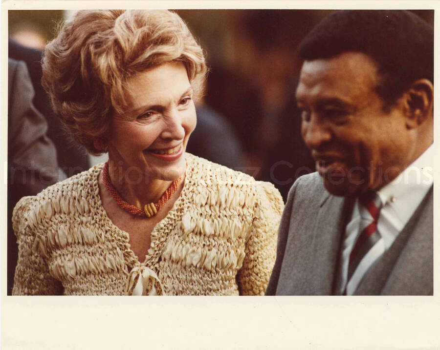 8 x 10 inch photograph. Lionel Hampton with First Lady Nancy Davis Reagan at an outdoor concert at the White House. This concert was aired January 27, 1982 on the public television special, Great Vibes! Lionel Hampton and Friends, as part of the Kennedy Center Tonight series