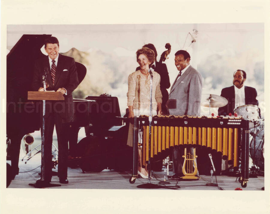 8 x 10 inch photograph. Lionel Hampton with President Ronald Reagan and First Lady Nancy Davis Reagan at an outdoor concert at the White House. This concert was aired January 27, 1982 on the public television special, Great Vibes! Lionel Hampton and Friends, as part of the Kennedy Center Tonight series