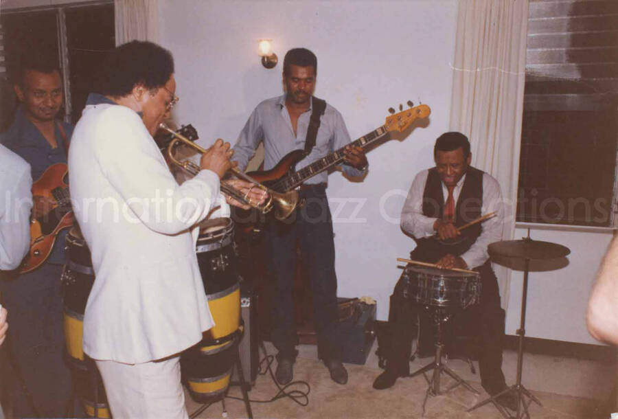 3 1/2 x 5 inch photograph. Lionel Hampton on drums with band at Bill Davis's home in Kingston, Jamaica