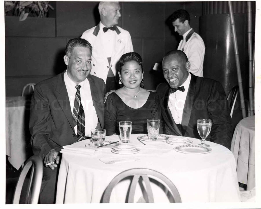 8 x 10 inch photograph. Thurgood Marshall, Cecilia Suyat, and Lionel Hampton. Accompanying this photograph is a portfolio from the Starlight Roof; The Waldorf-Astoria Hotel, N. Y.