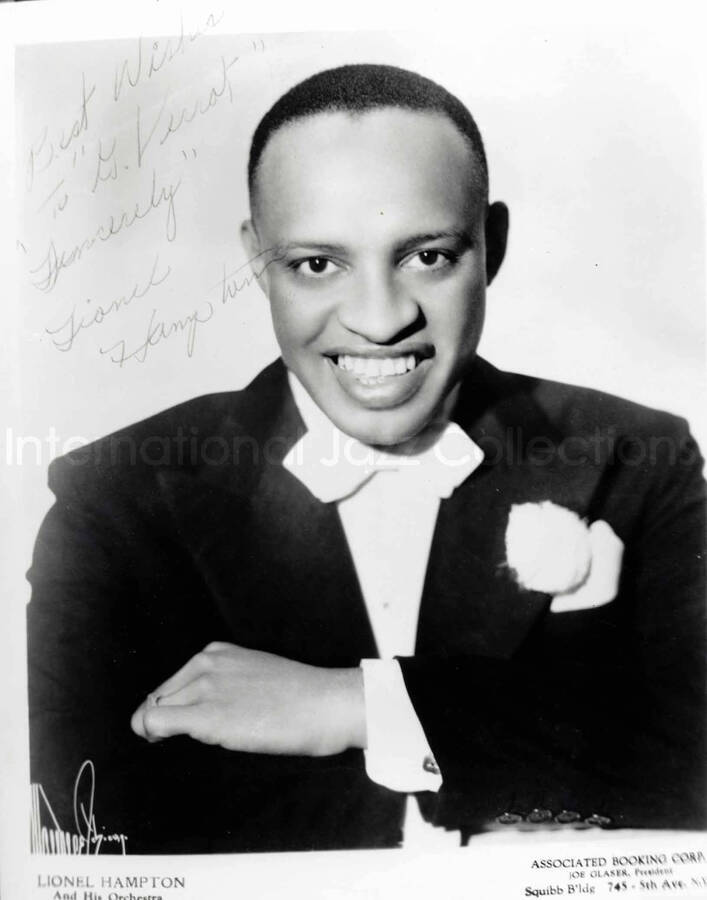 14 x 11 inch promotional photograph. Lionel Hampton. Inscribed at the bottom of the photograph: Lionel Hampton and His Orchestra. This is an enlarged copy of a photograph dedicated to G. Verrot [?] from Lionel Hampton