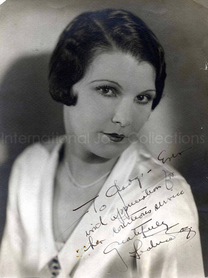 12 x 9 inch photograph. Portrait of a woman. Stamped on the back of the photograph: Leatrice Joy; Star for Cecil B. De Mille. This photograph is dedicated to Gladys Hampton from Leatrice Joy.