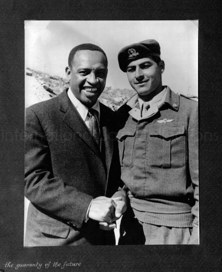 10 x 8 inch photograph. Lionel Hampton in Israel. This photograph is in a photo album titled: In the Holy City - Jerusalem. Caption under the photograph reads: the guaranty of the future