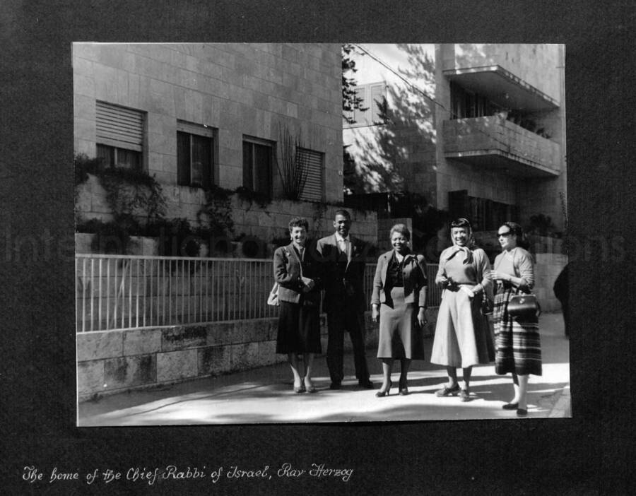 10 x 10 inch photograph. Lionel Hampton in Israel. This photograph is in a photo album titled: In the Holy City - Jerusalem. Caption under the photograph reads: The home of the Chief Rabbi of Israel, Rav Herzog