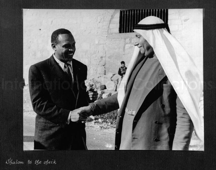 8 x 10 inch photograph. Lionel Hampton in Israel. This photograph is in a photo album titled: In the Holy City - Jerusalem. Caption under the photograph reads: Shalom to the sheik
