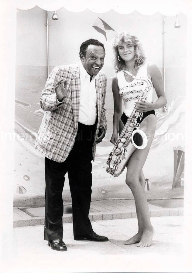 12 x 8 inch photograph. Lionel Hampton with unidentified woman [in France]
