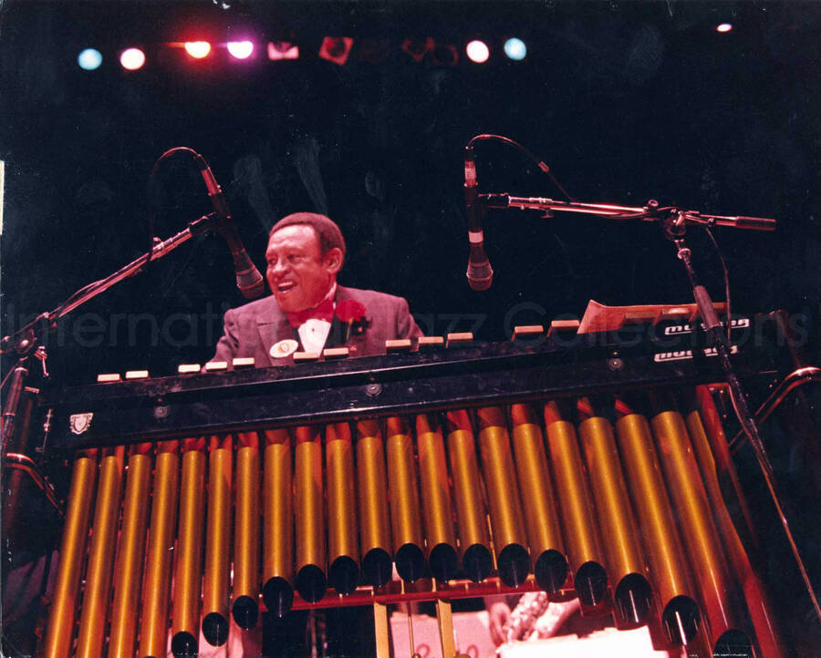 10 1/2 x 13 1/2 inch photograph. Lionel Hampton playing the vibraphone at the University of Idaho, Moscow, ID. This photograph is mounted on cardboard